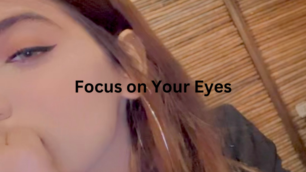 A striking image of a beautiful girl showcasing trendy eye makeup that enhances her natural beauty.